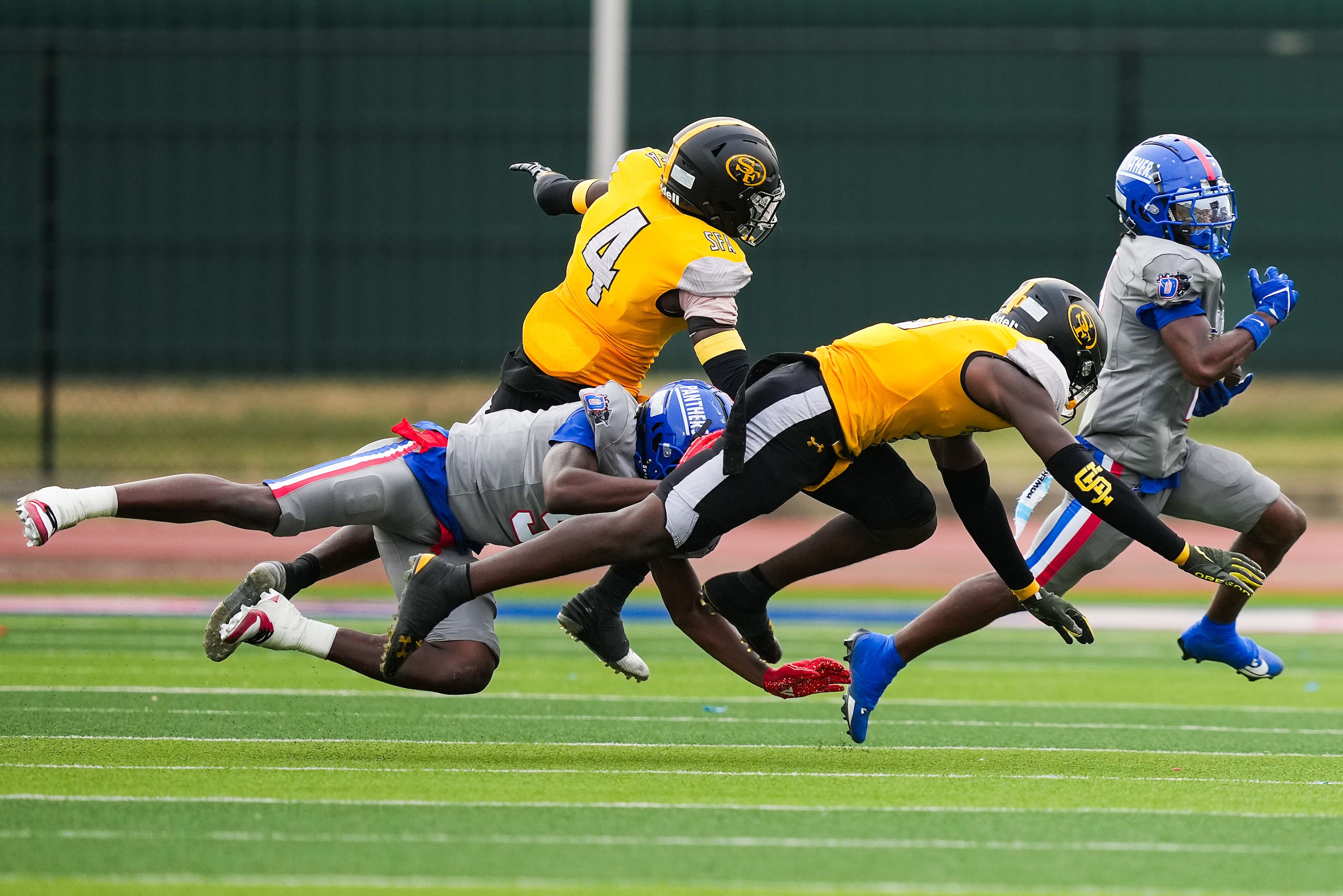 Duncanville wide receiver Ayson Theus (2) gets past St. Frances Academy defensive back Jireh...