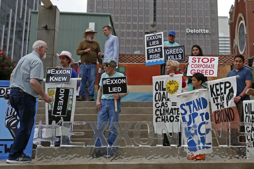 Protesters gathered at the 2016 annual meeting of Exxon Mobil shareholders in Dallas.