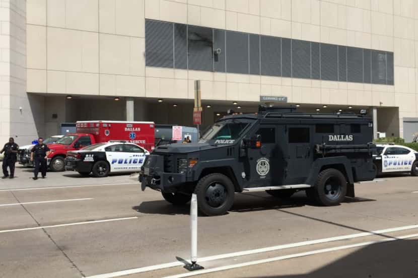  SWAT leaving the Omni Dallas Hotel after responding to a call of a man who had barricaded...