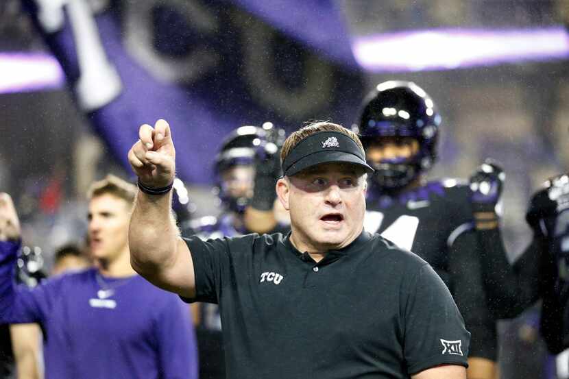 TCU Horned Frogs head coach Gary Patterson participates in the school song following their...