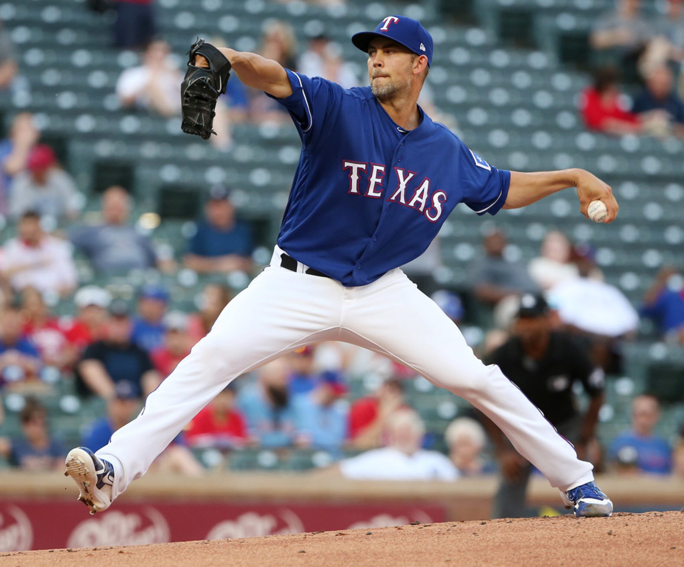 Texas Rangers starting pitcher Mike Minor (36) pitches in the first inning during a Major...