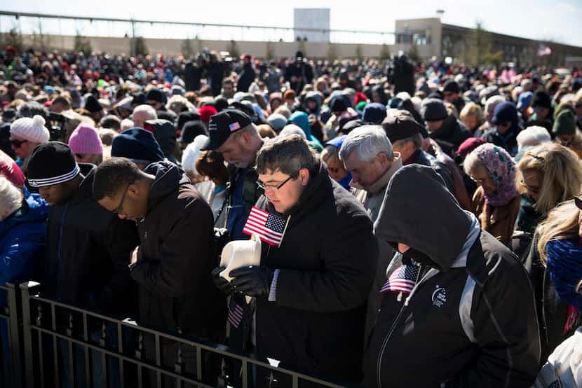 Thousands pray during a speech by the Rev. Franklin Graham, the son of Rev. Bill Graham, as...