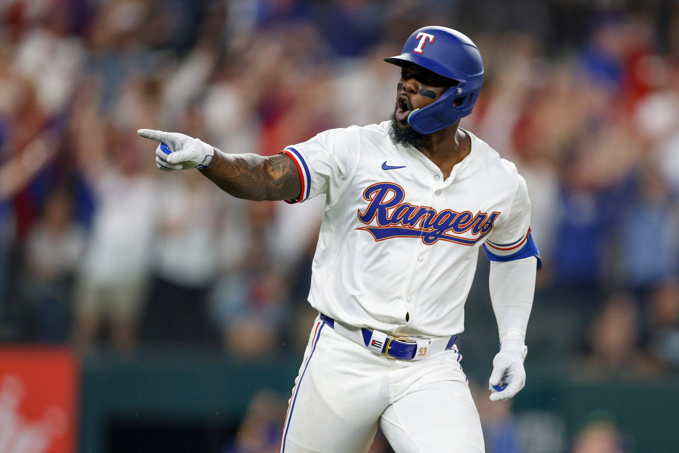 Texas Rangers right fielder Adolis Garcia (53) reacts after hitting a solo home run during...