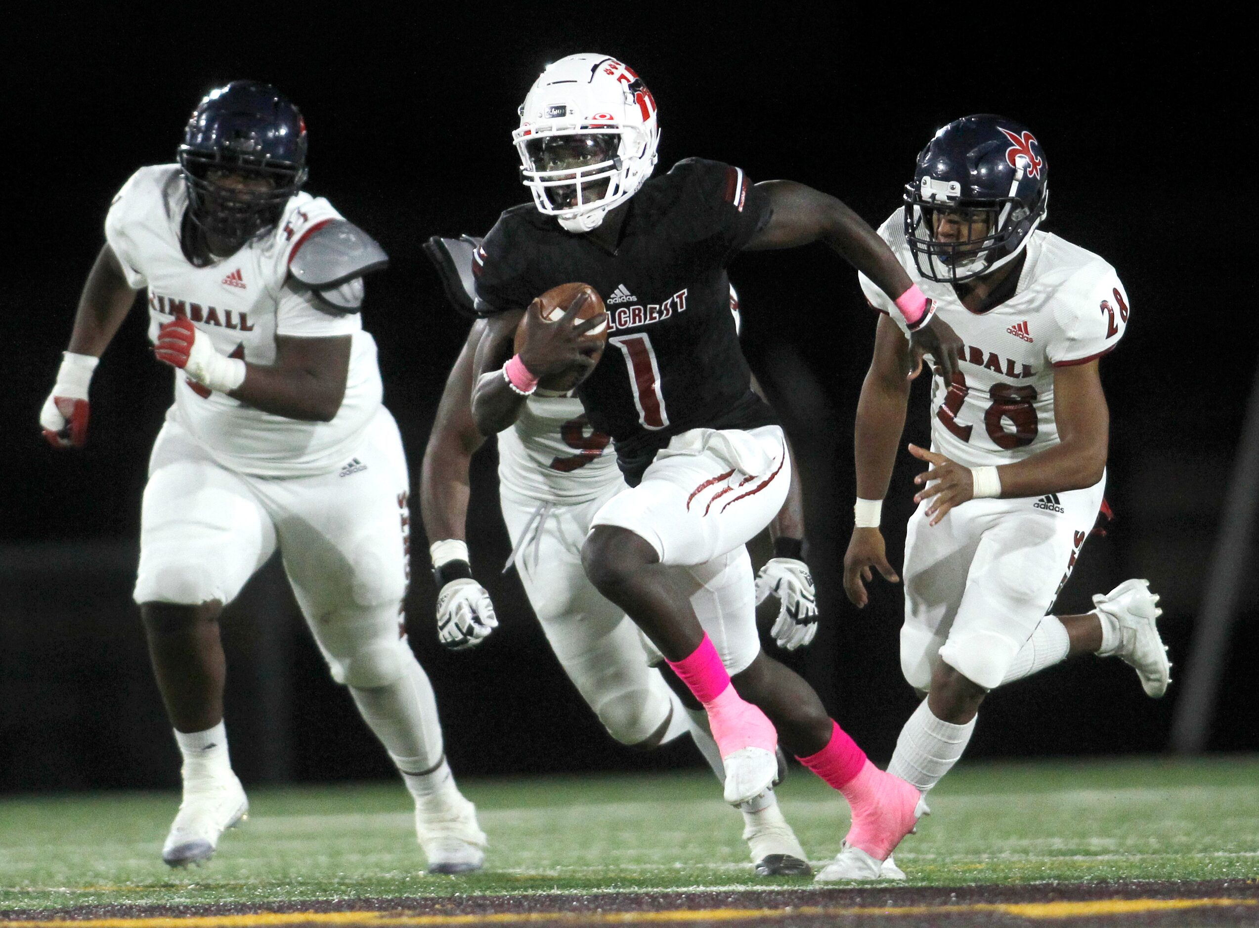 Dallas Hillcrest quarterback Carter Sido (1) sprints into the Knights' secondary as he is...