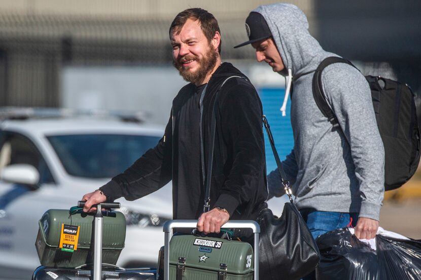 Dallas Stars goalie Anton Khudobin (left) and the rest of the Dallas Stars team return home...