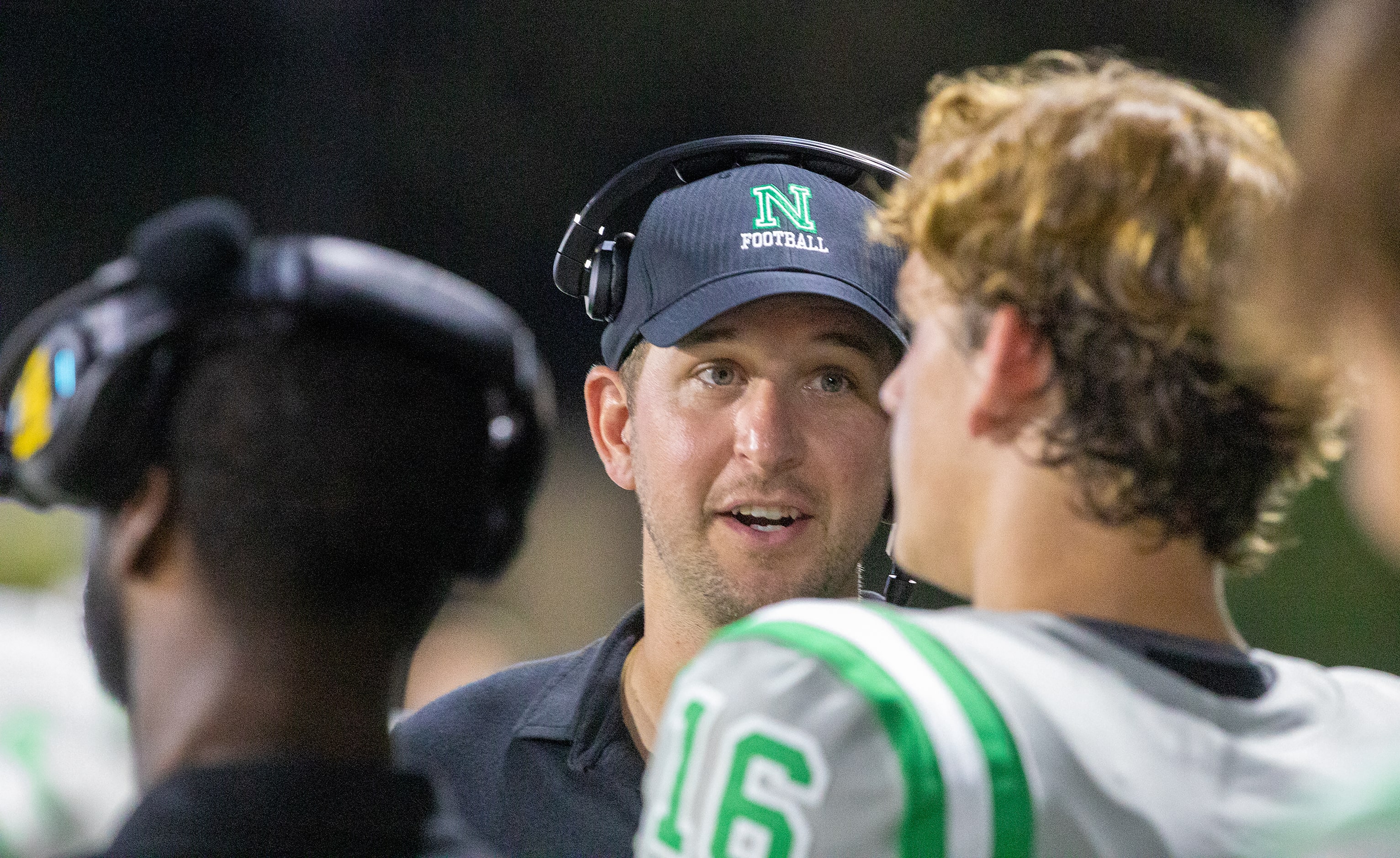 Former CFL quarterback Logan Kilgore coaches Arch Manning as Newman High School takes on...