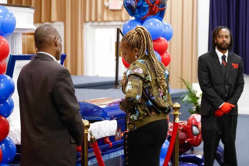 LaTanya Reese, grandmother of late Legend Chappell, looks at her grandson’s casket while...