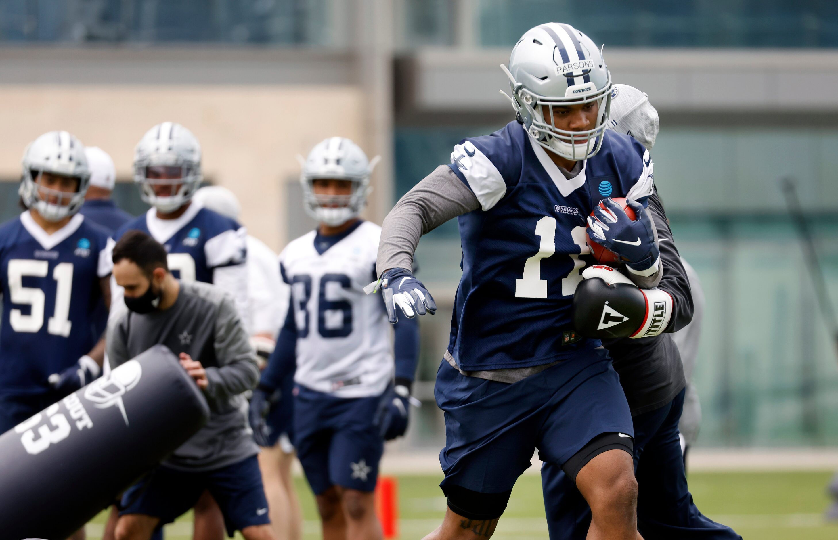 Dallas Cowboys rookie linebacker Micah Parsons (11) runs through drills during rookie...