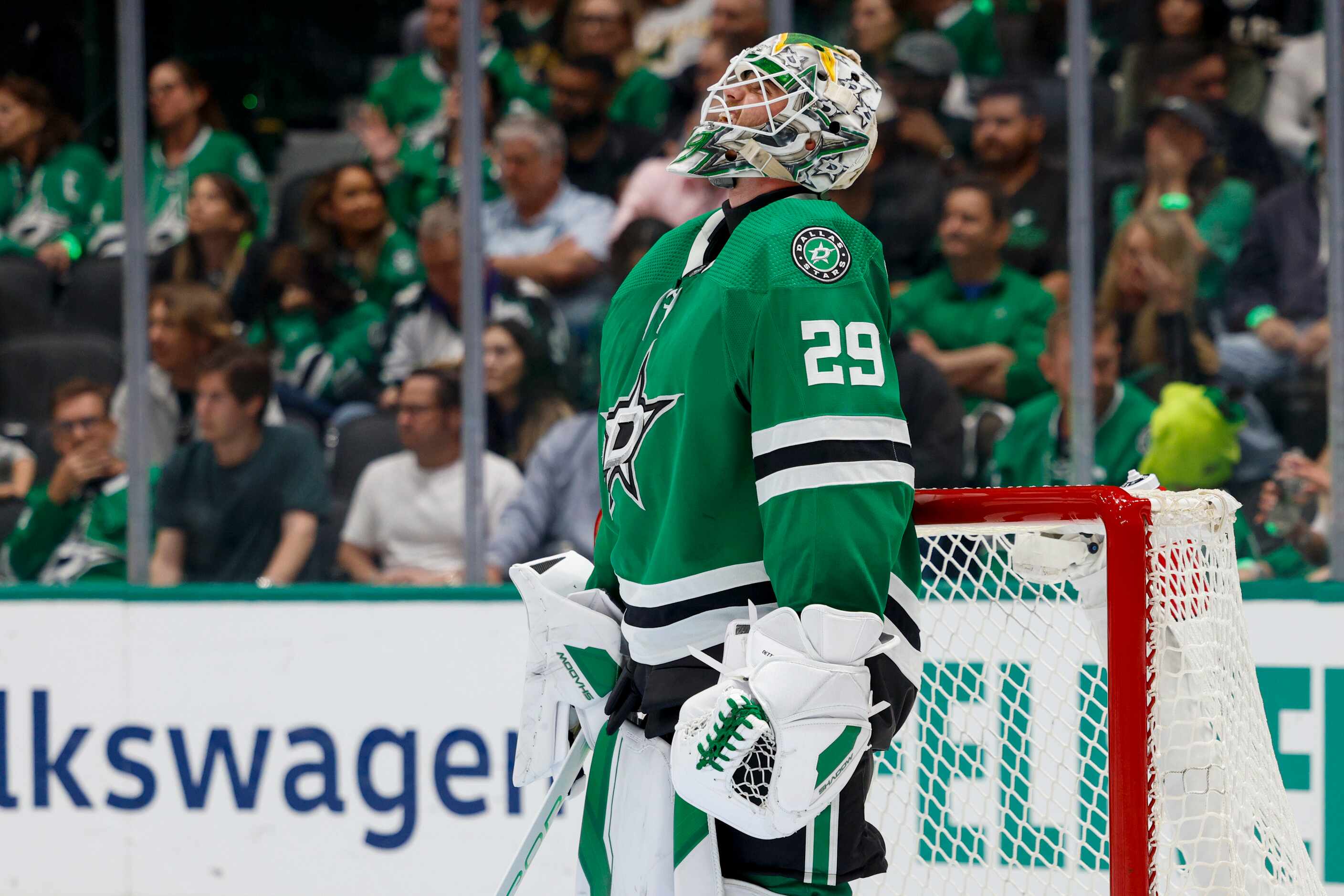 Dallas Stars goaltender Jake Oettinger (29) watches a replay after giving up a goal during...