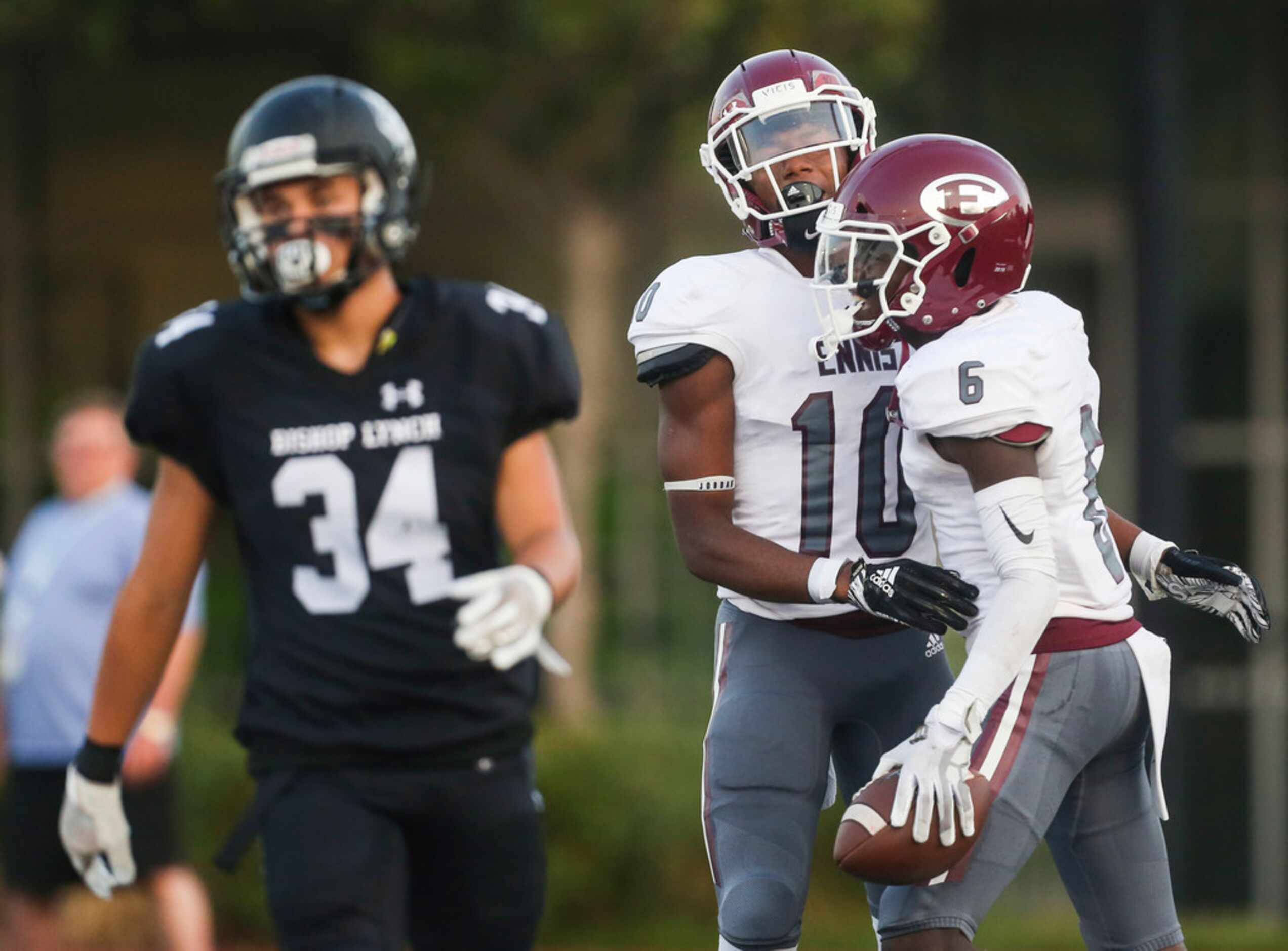 Ennis wide receiver Karon Smith (6) celebrates with wide receiver Azain Brown (10) after...