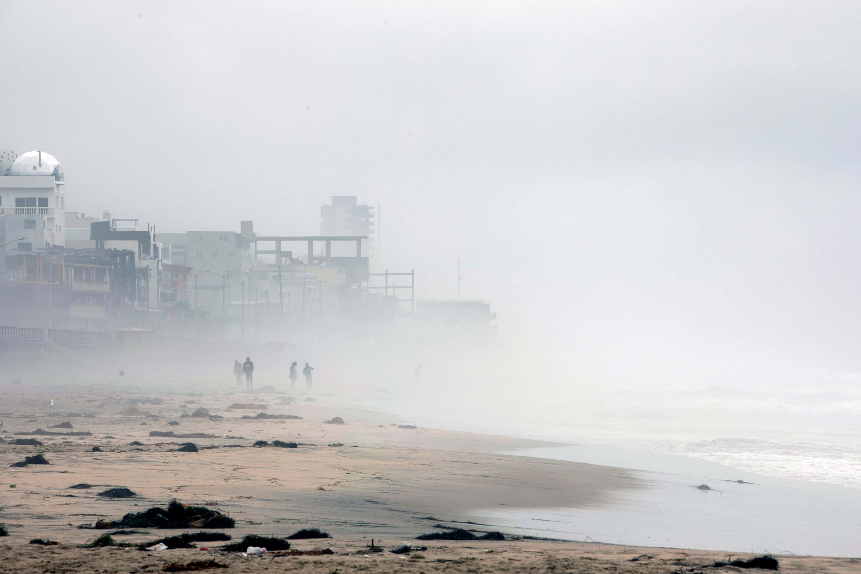 People ignore caution signs for beach closings at Las Playas de Tijuana as Tropical Storm...