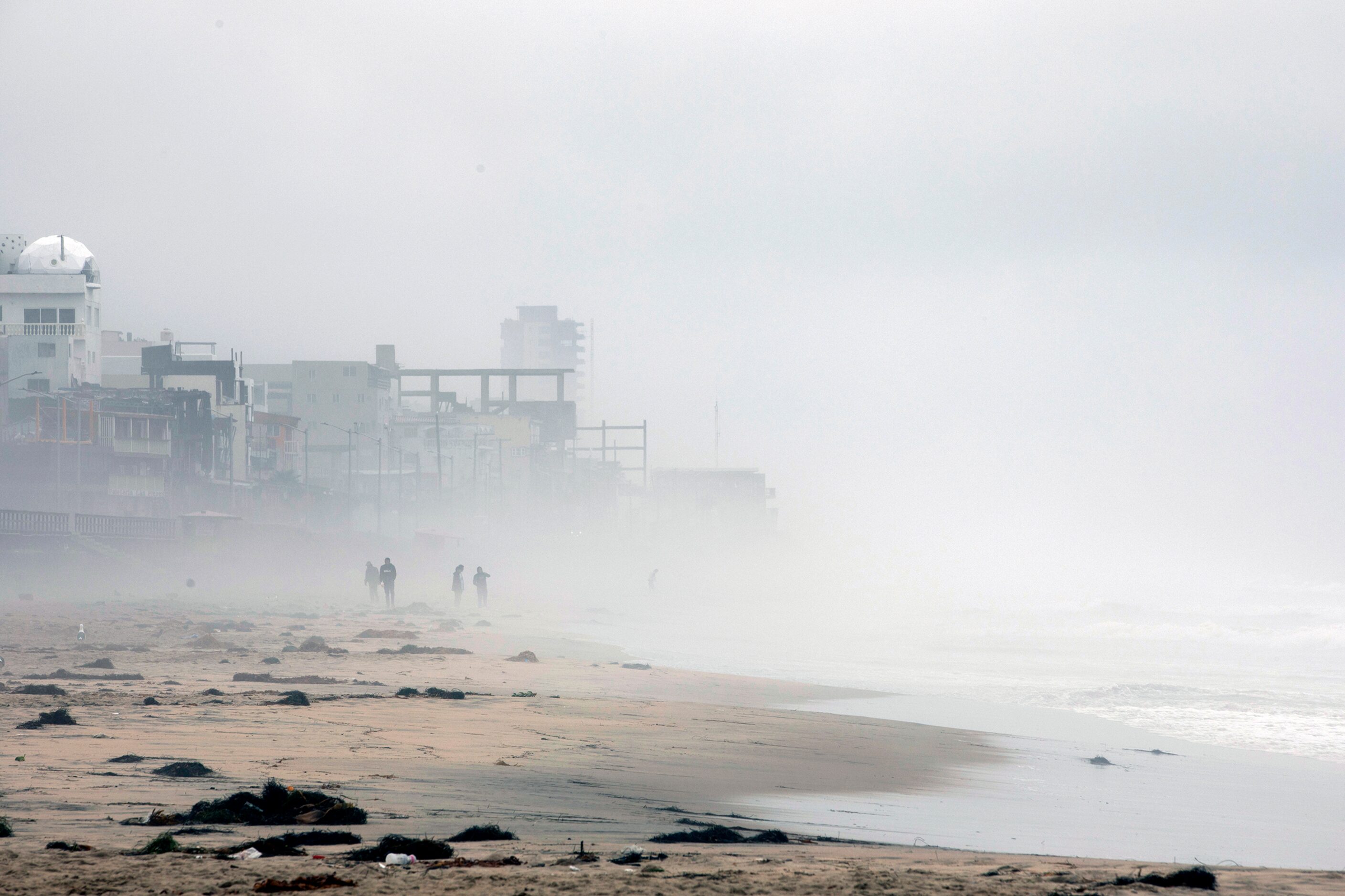 People ignore caution signs for beach closings at Las Playas de Tijuana as Tropical Storm...