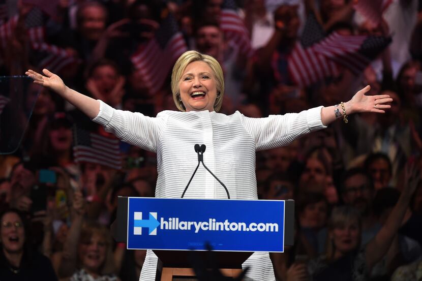 Democratic presidential candidate Hillary Clinton acknowledges celebratory cheers from the...