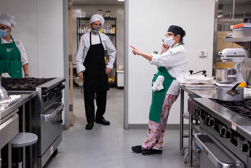 Chef Jodi Duryea (right) speaks to her baking class at the University of North Texas...