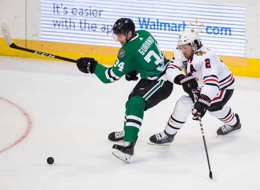 Dallas Stars right wing Denis Gurianov (34) and Chicago Blackhawks defenseman Duncan Keith...