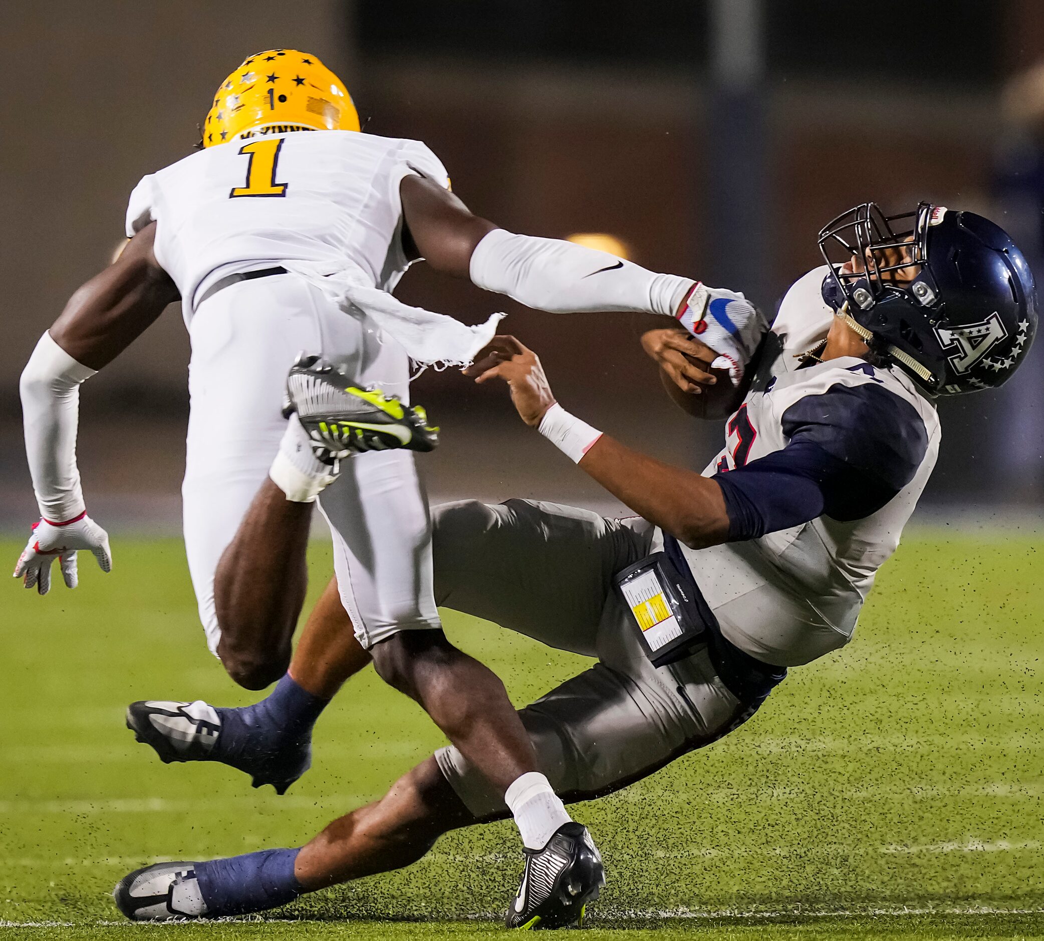 Allen quarterback Mike Hawkins (3) is dropped for a loss by McKinney defensive back Xavier...