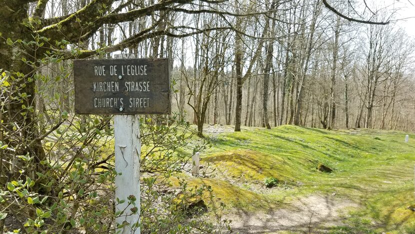 Signs mark the former locations of streets, homes, farms and businesses in...