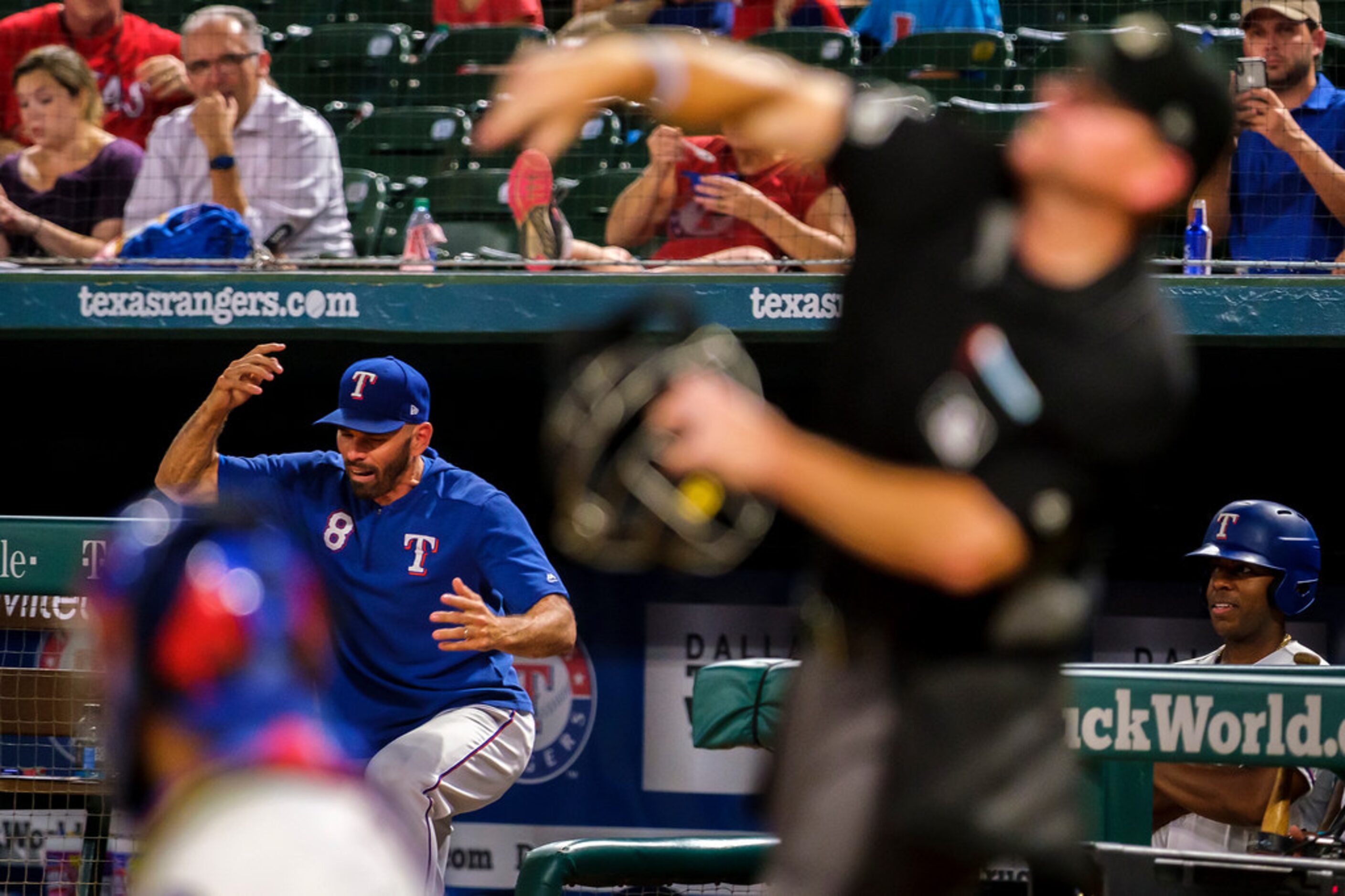 Texas Rangers manager Chris Woodward reacts as he is ejected from the game by umpire Mike...