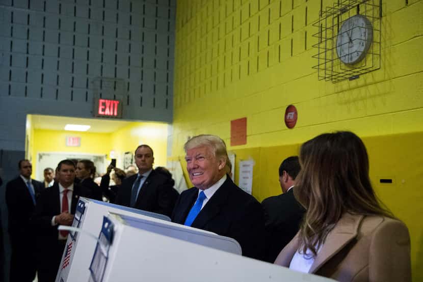 Donald Trump and his wife Melania Trump cast ballots at a polling station inside Public...