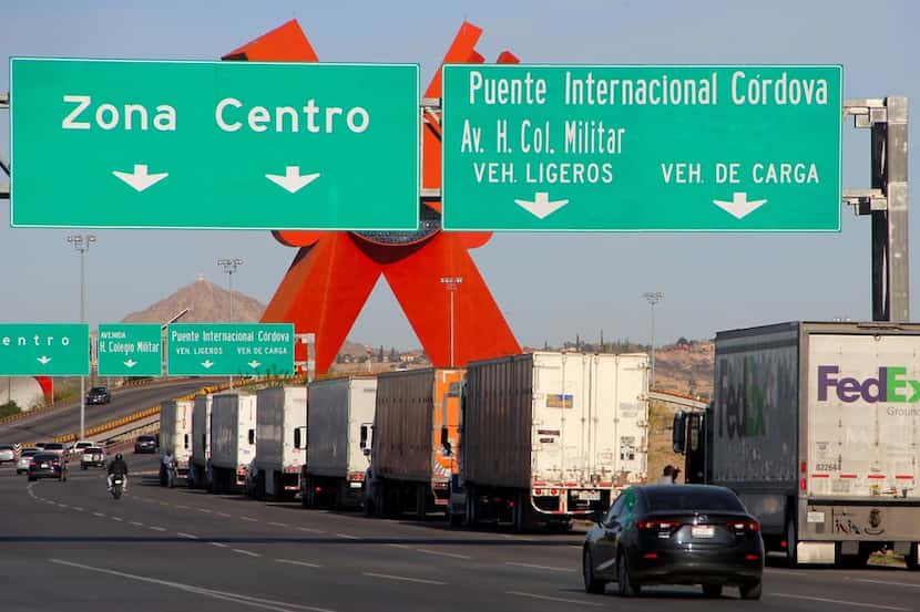 Trucks such as these near the U.S.-Mexico border in Ciudad Juarez are still boosting trade,...