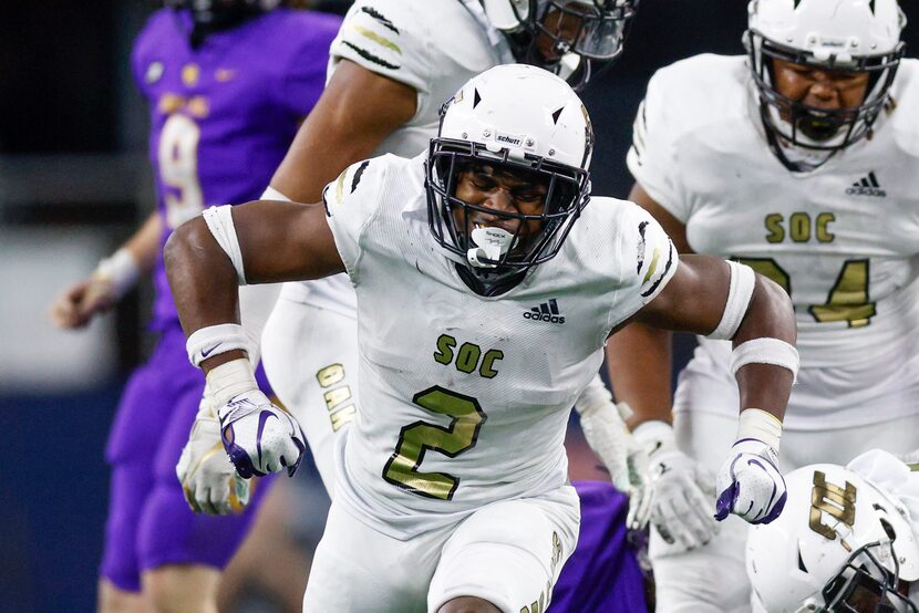 South Oak Cliff defensive back Kyron Chambers (2) celebrates a tackle during the second half...