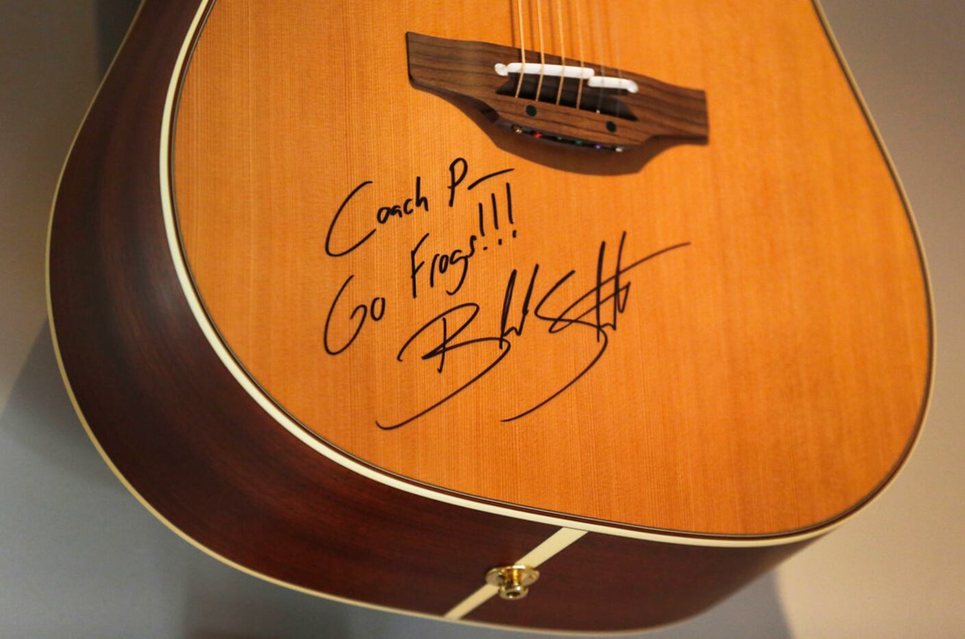 A guitar autographed by Blake Shelton to TCU head football coach Gary Patterson is on...