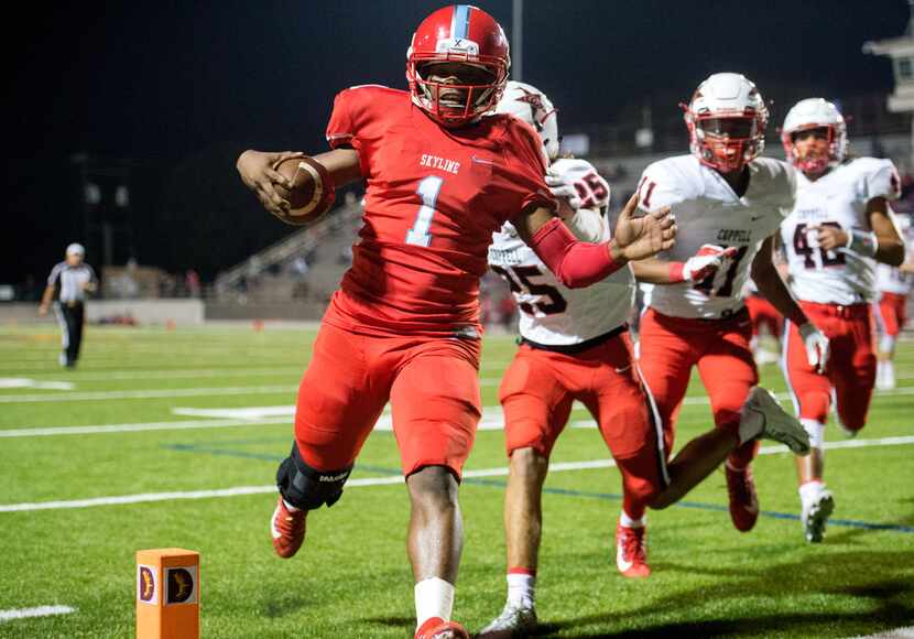 Skyline quarterback Velton Gardner (1) runs for a touchdown against Coppell in the first...