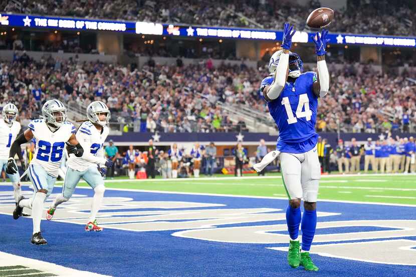 Seattle Seahawks wide receiver DK Metcalf (14) catches a touchdown  pass as Dallas Cowboys...