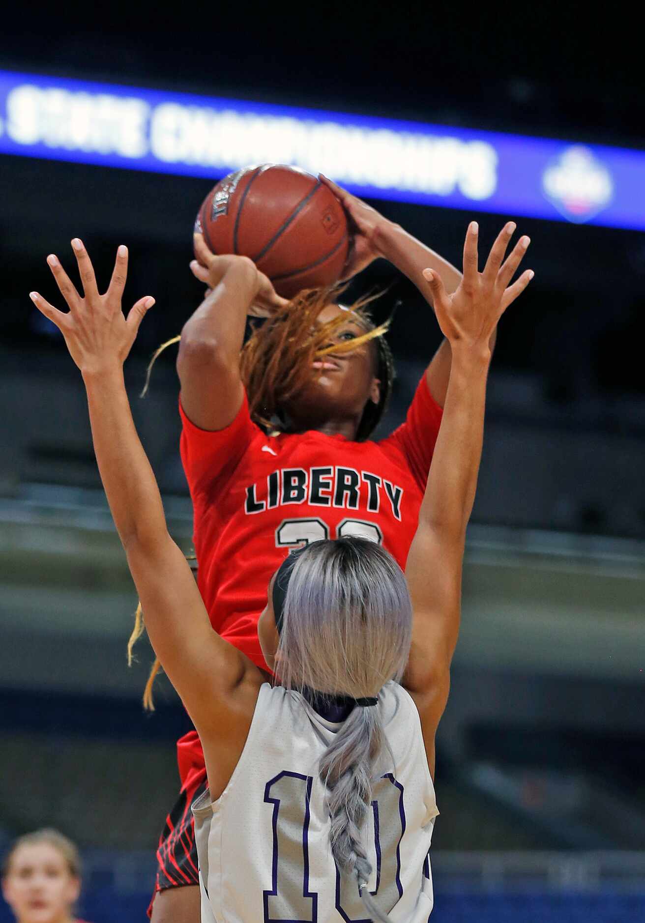 Frisco Liberty Jazzy Owens-Barnett shoots over College Station guard Mia Rivers #10 in...