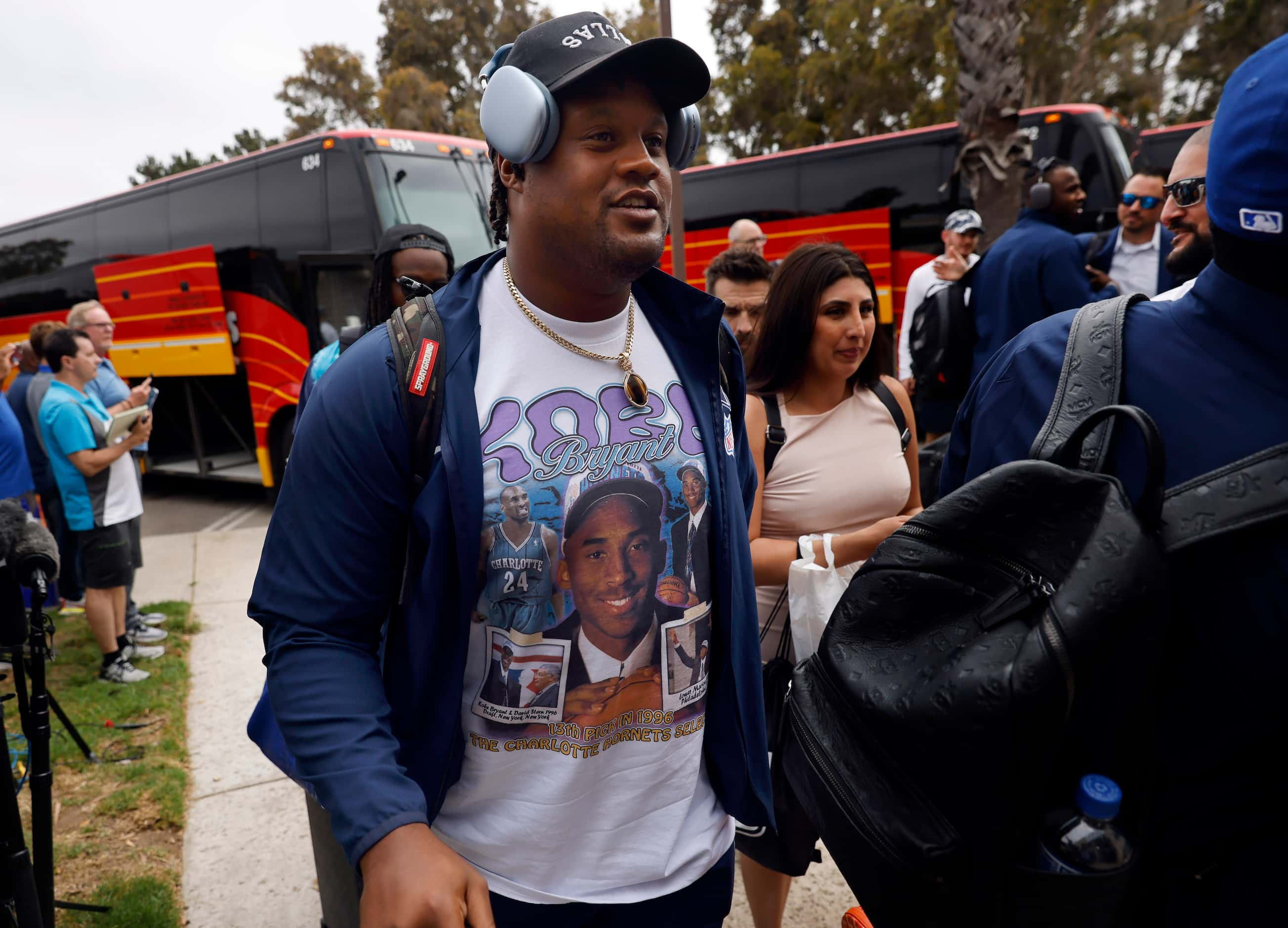 Dallas Cowboys defensive end Carlos Watkins and his teammates arrive on buses at the...