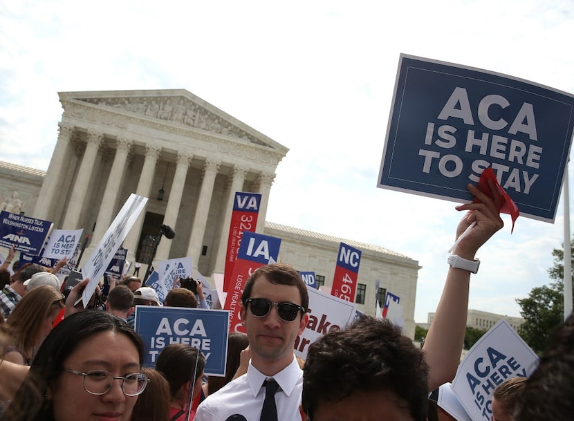  People celebrate in front of the US Supreme Court after ruling was announced on the...