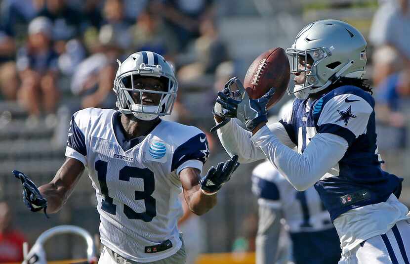 Dallas Cowboys cornerback Charvarius Ward (40) intercepts a pass intended for wide receiver...