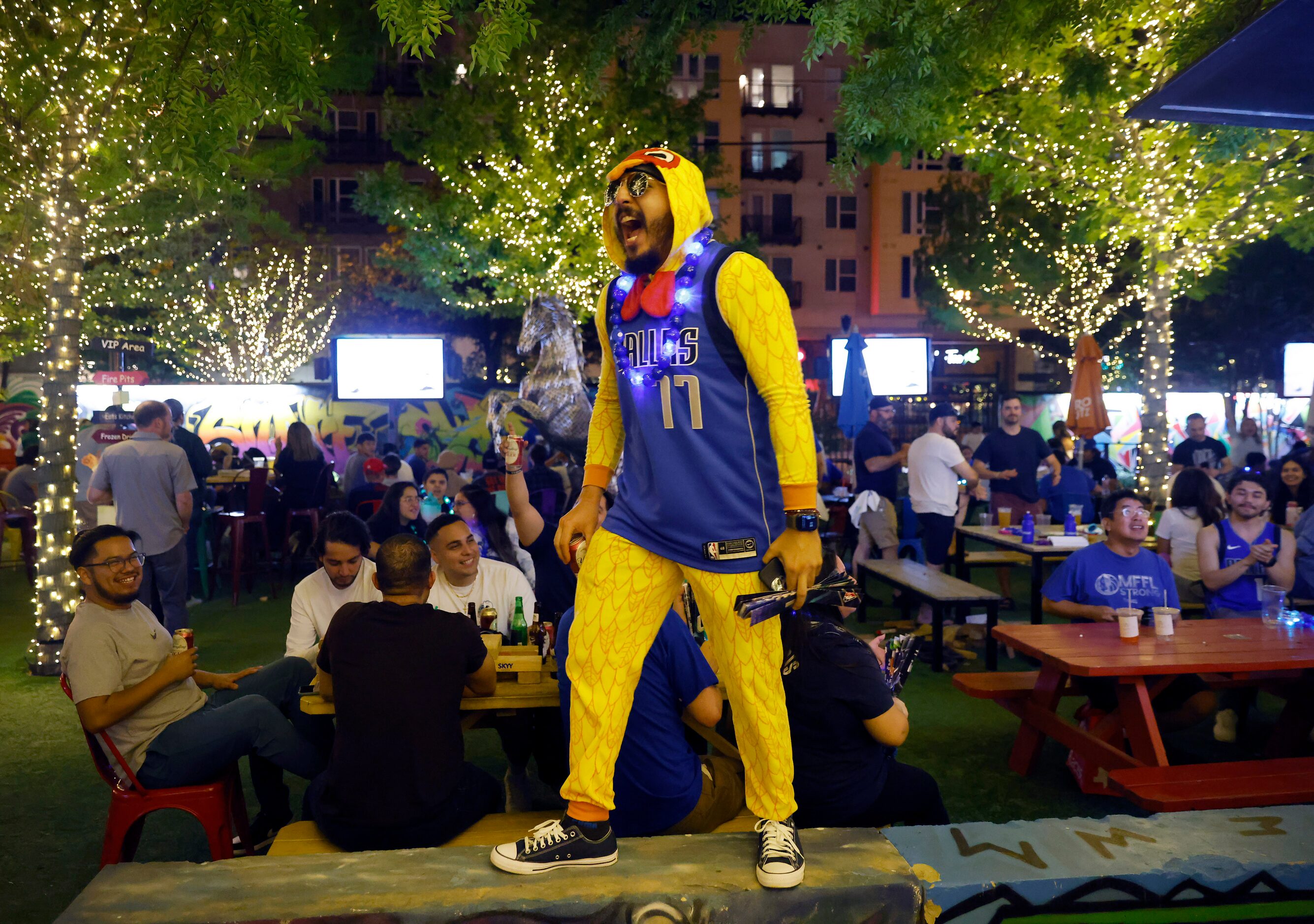 Self-described Chicken Man Rudy Nunez of Dallas gets Dallas Mavericks fans fired up during a...