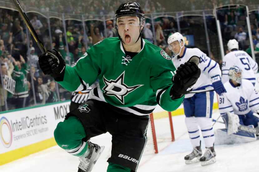 Dallas Stars center Devin Shore (17) reacts to scoring a goal against Toronto Maple Leafs...