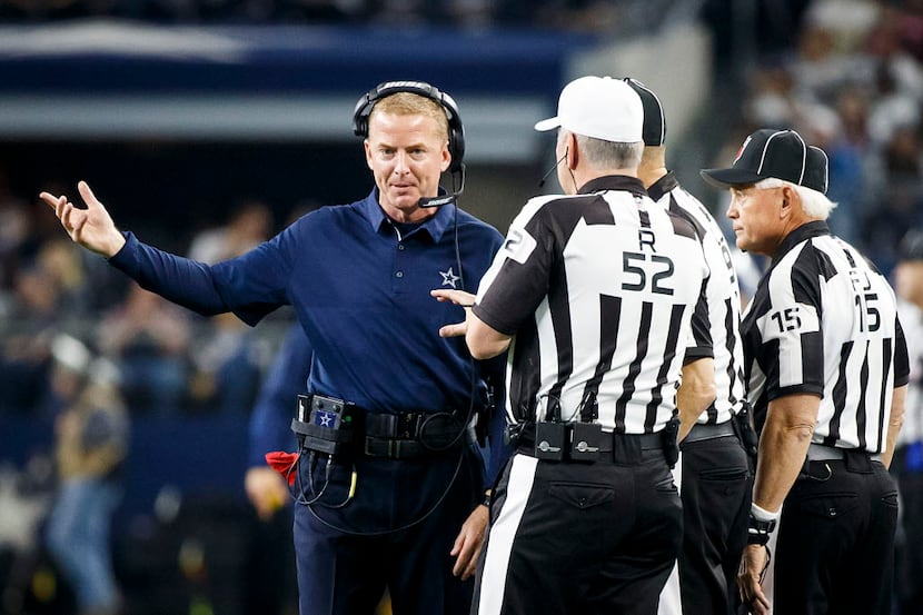 Dallas Cowboys head coach Jason Garrett looks for a call from referee Bill Vinovish (52)...