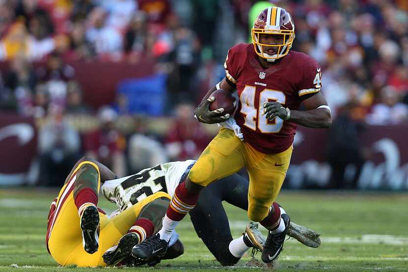 LANDOVER, MD - NOVEMBER 15: Running back Alfred Morris #46 of the Washington Redskins rushes...