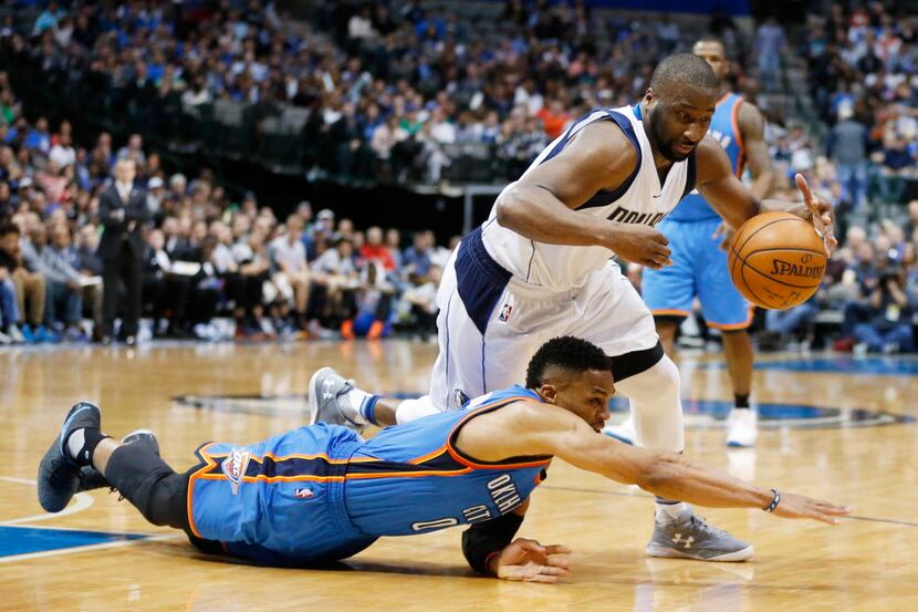 Dallas Mavericks guard Raymond Felton (2) is fouled by Oklahoma City Thunder guard Russell...