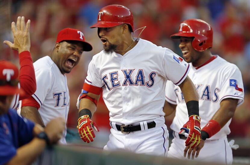 Texas Rangers second baseman Rougned Odor celebrates his two-run homer during a big first...