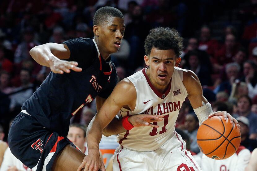 FILE - In this Tuesday, Jan. 9, 2018 file photo, Oklahoma's Trae Young (11) drives the ball...