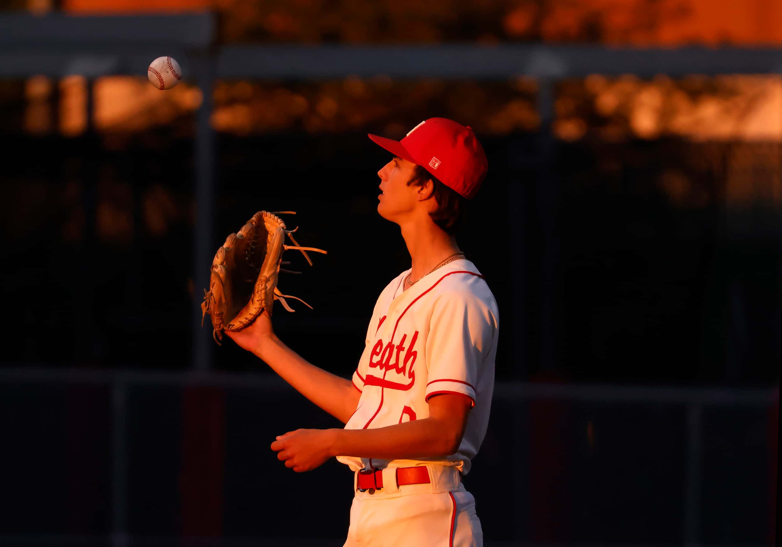 Rockwall-Heath High starting pitcher Landon Ammerman (9) tosses the baseball as he waits for...