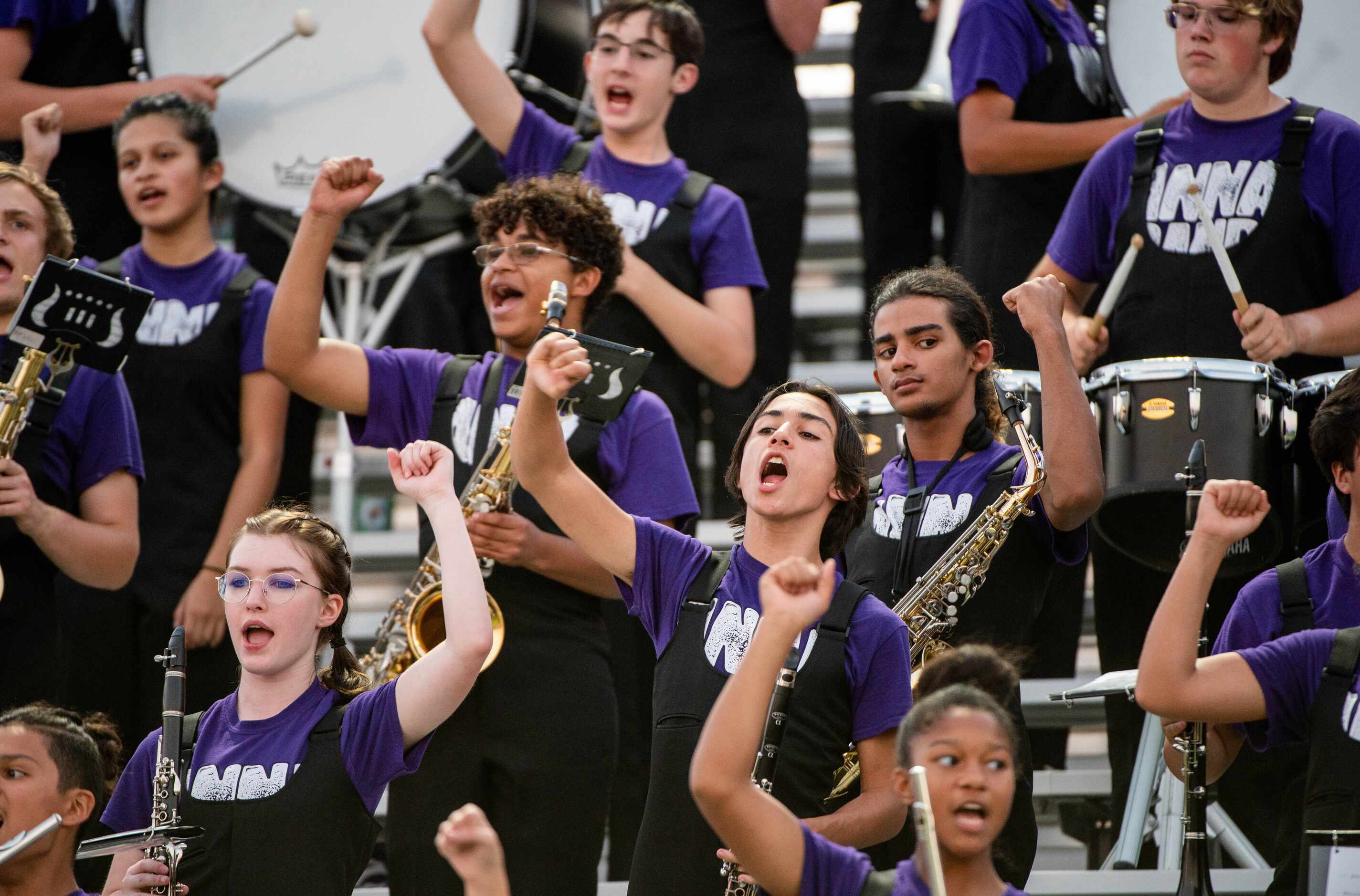 Anna band members cheer in the stands during a high school football game against Celina,...
