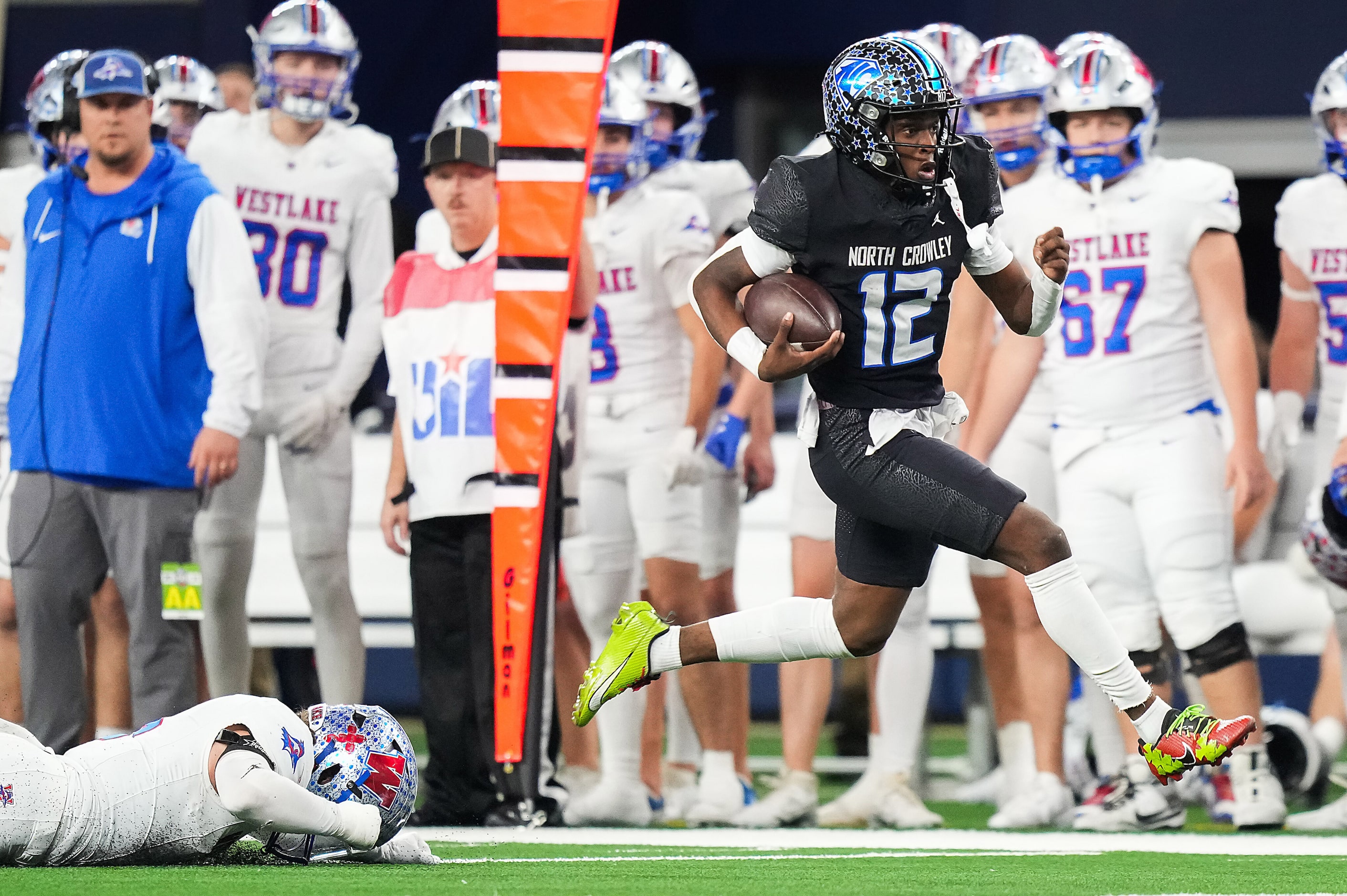 North Crowley quarterback Chris Jimerson (12) gets past Austin Westlake linebacker Payton...