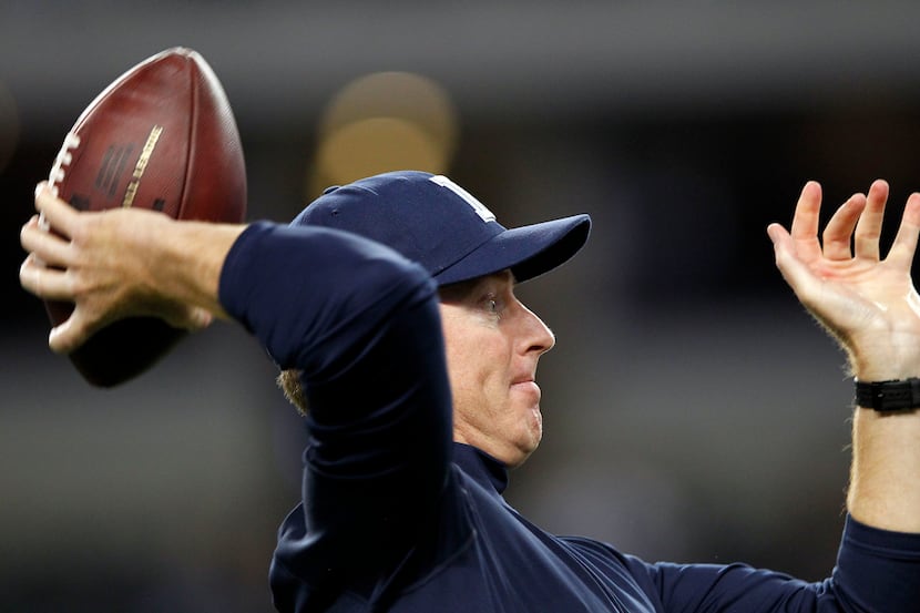 Dallas Cowboys head coach Jason Garrett throws the ball to Dallas Cowboys wide receiver Dez...