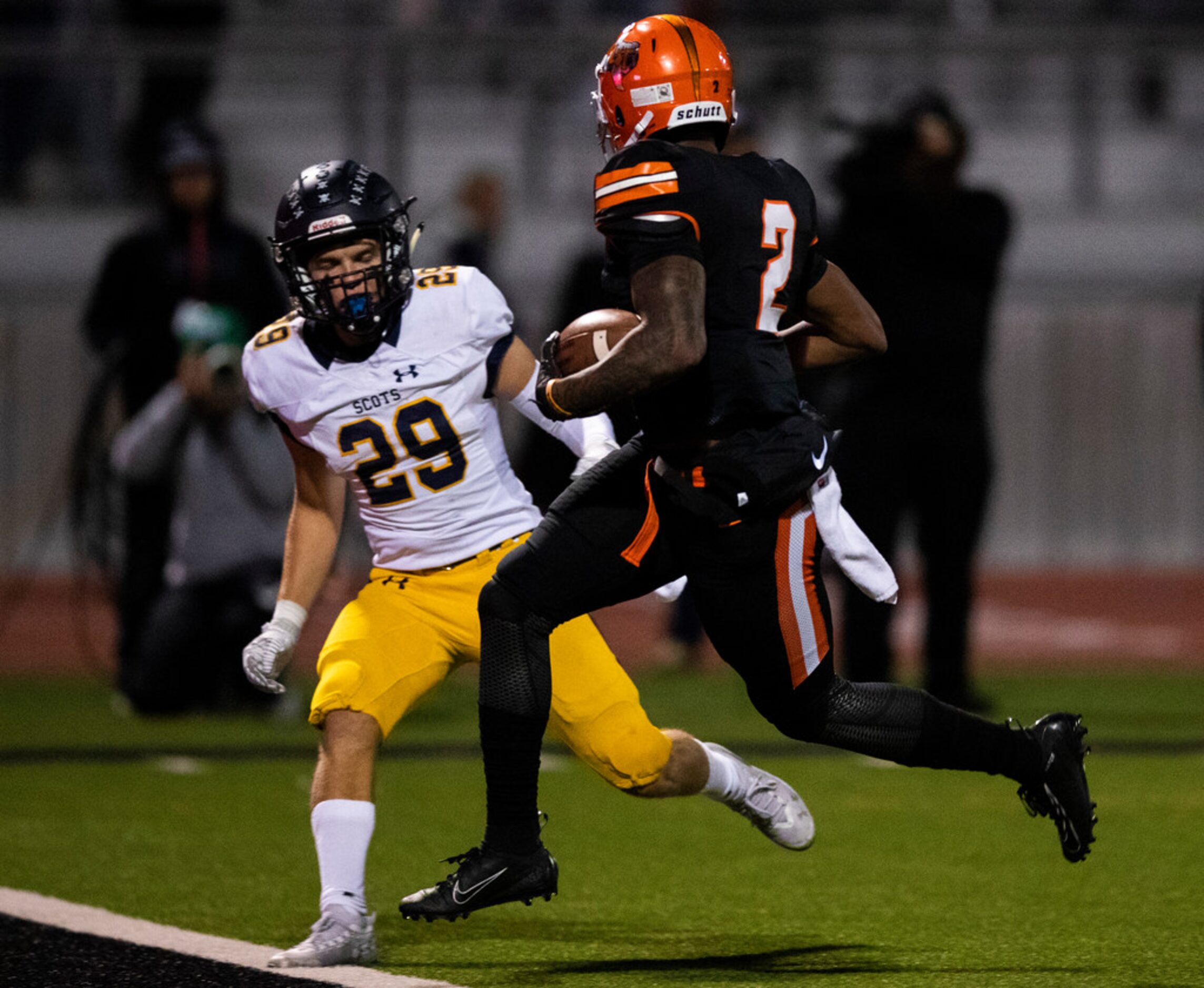 Lancaster running back Tre Bradford (2) runs across the goal line for a touchdown with...