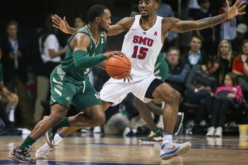 South Florida Bulls guard LaQuincy Rideau (3) drives past Southern Methodist Mustangs...