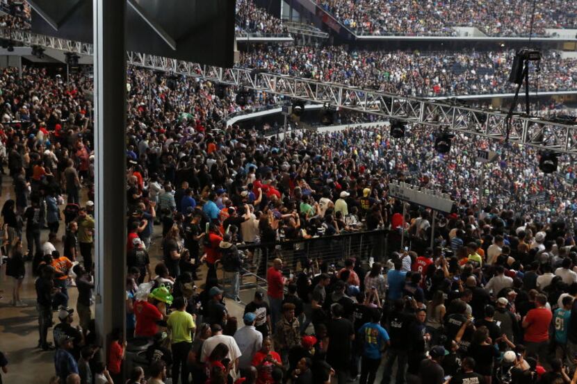 WWE fans fill the party pass zone before WrestleMania 32 at AT&T Stadium in Arlington, TX,...