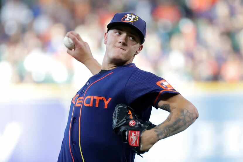 Houston Astros starting pitcher Hunter Brown throws against the Texas Rangers during the...