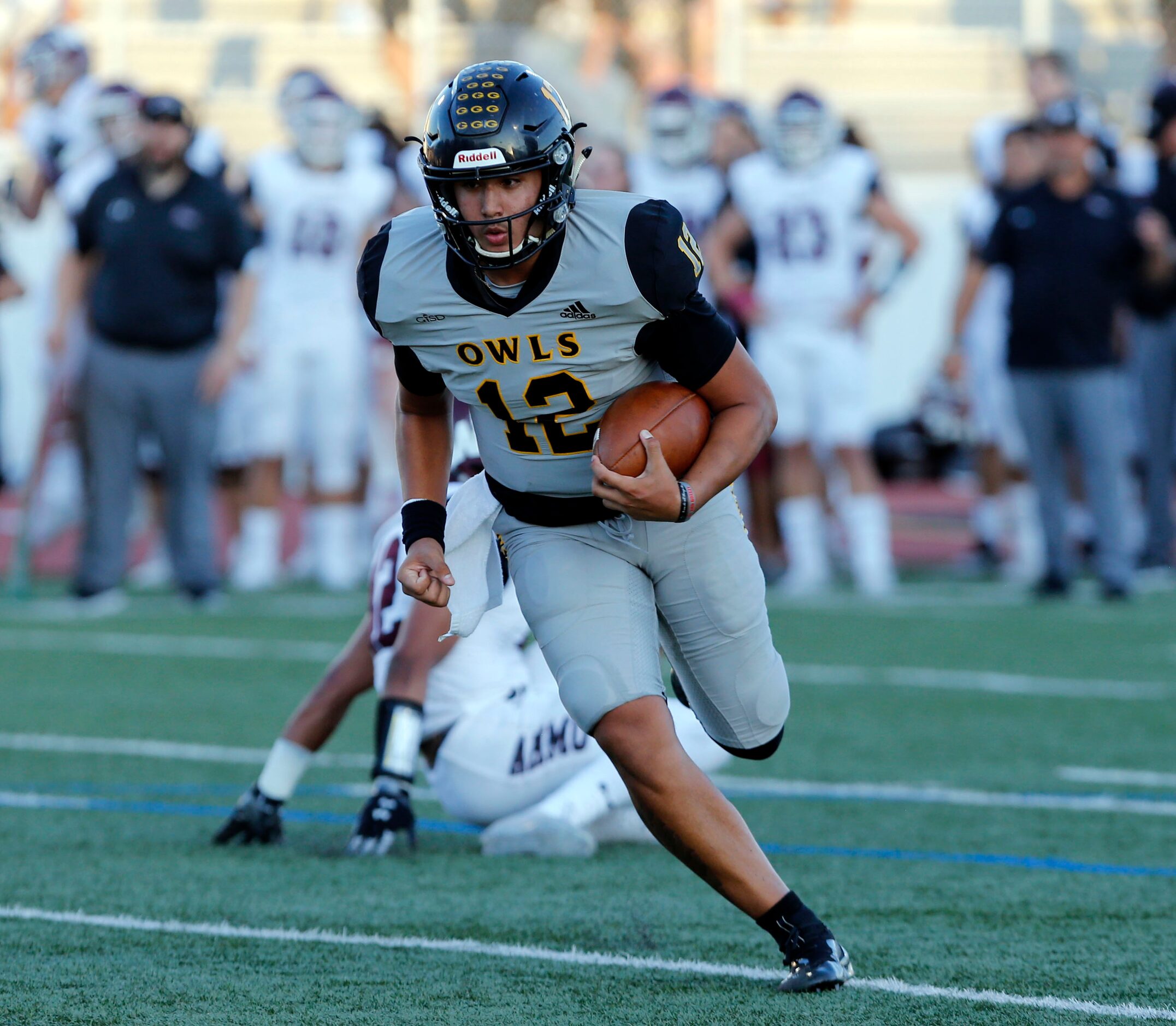 Garland QB Cergio Perez (12) heads to the end zone for the Owl’s first touchdown of the...