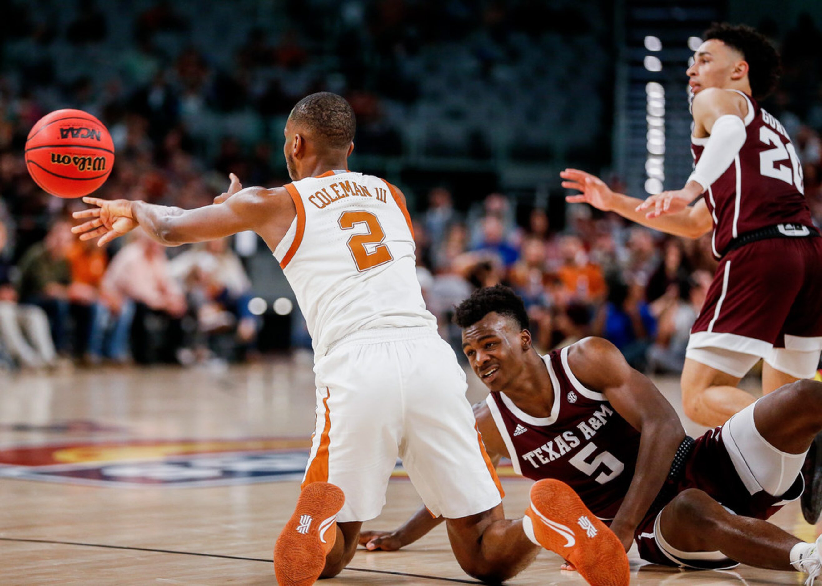 Texas Longhorns guard Matt Coleman III (2) steals the ball from Texas A&M Aggies forward...