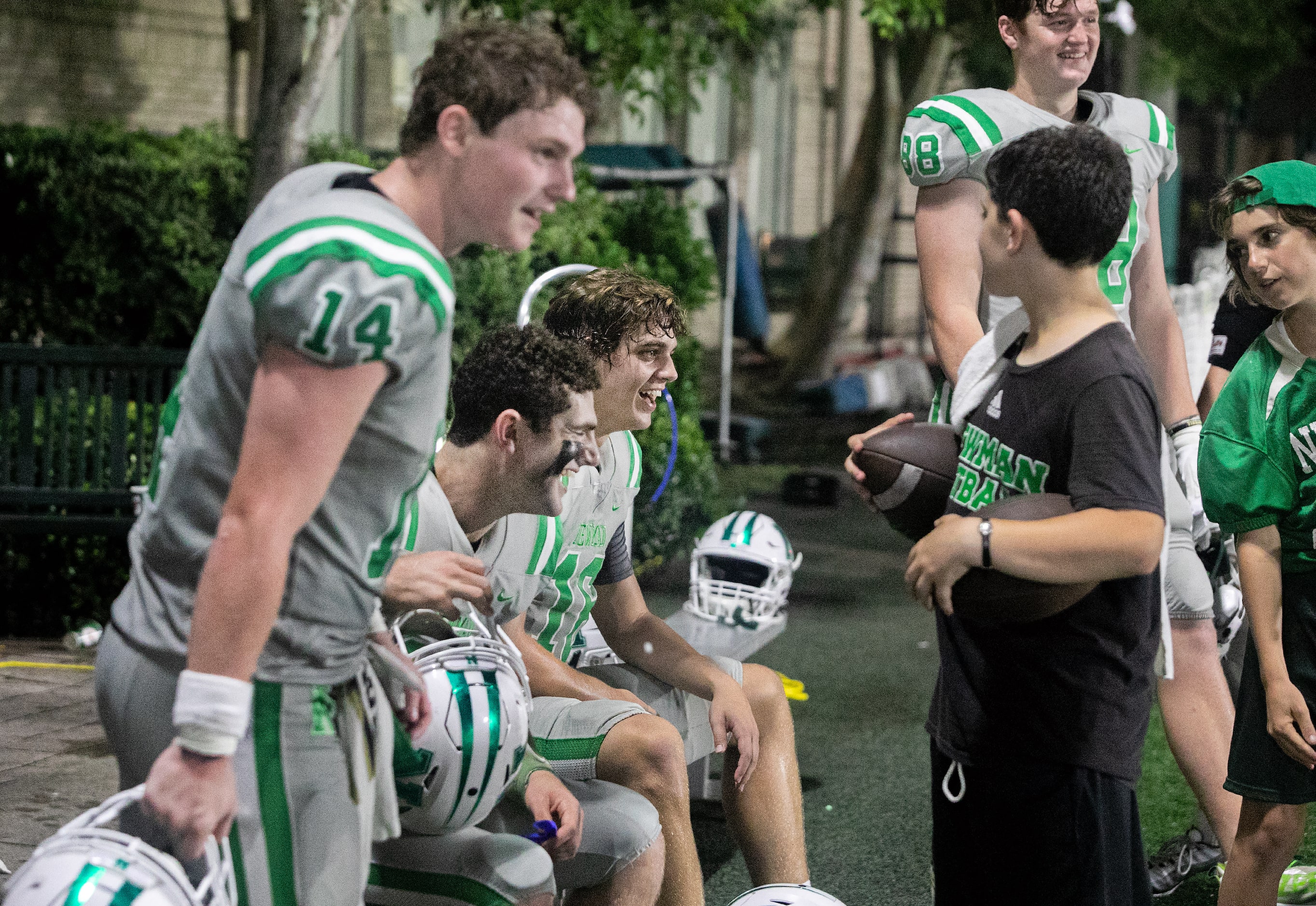 Arch Manning jokes with teammates as Newman High School takes on Riverside Academy Friday,...